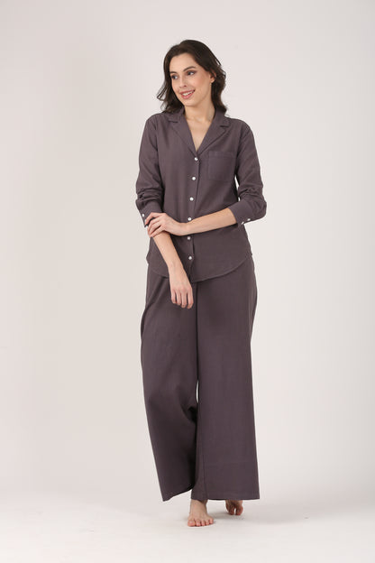 Model wearing charcoal grey linen-cotton wide-leg flare pants styled with a matching lapel collar shirt, shown as a relaxed co-ord set for everyday wear.